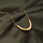 Palmonas Golden Boomerang Necklace