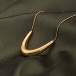 Palmonas Golden Boomerang Necklace